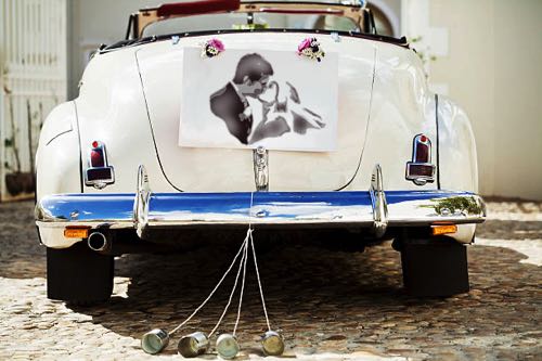 Wedding kiss stenciled onto Just Married car