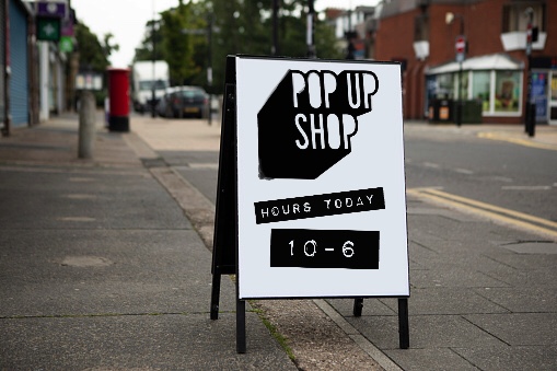 Popup sign stenciled onto sandwich board